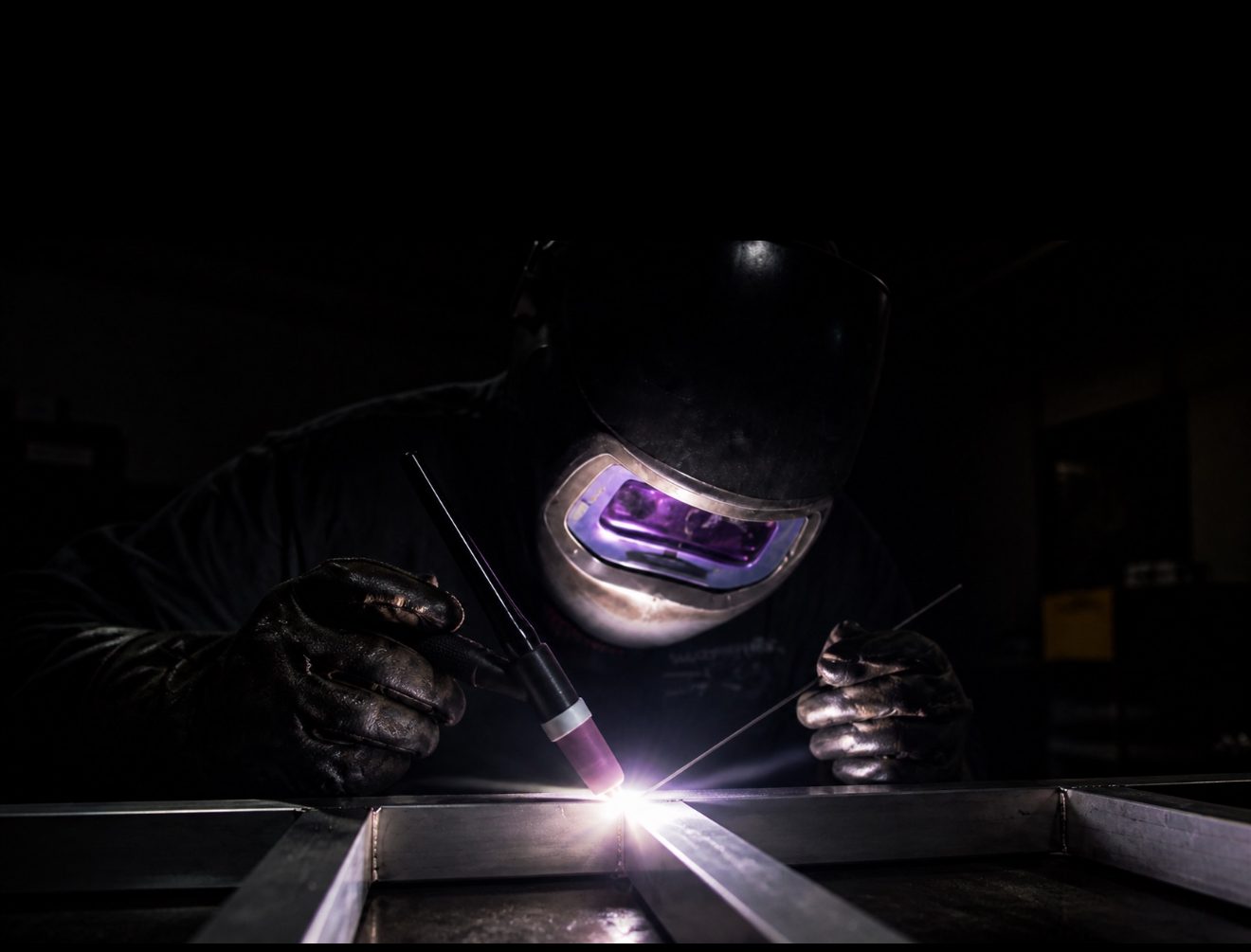 Victory welder running a TIG bead on a steel assembly