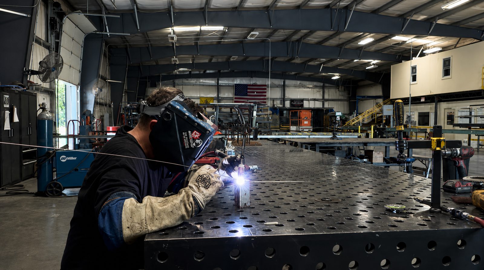 Victory welder working on the fabrication table