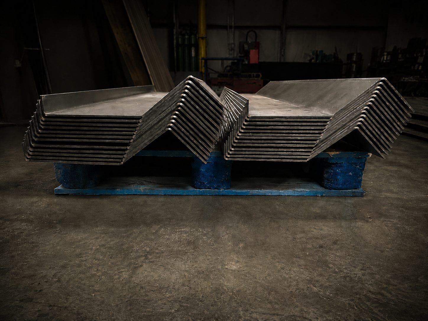 Stacked formed steel plates with matching bends